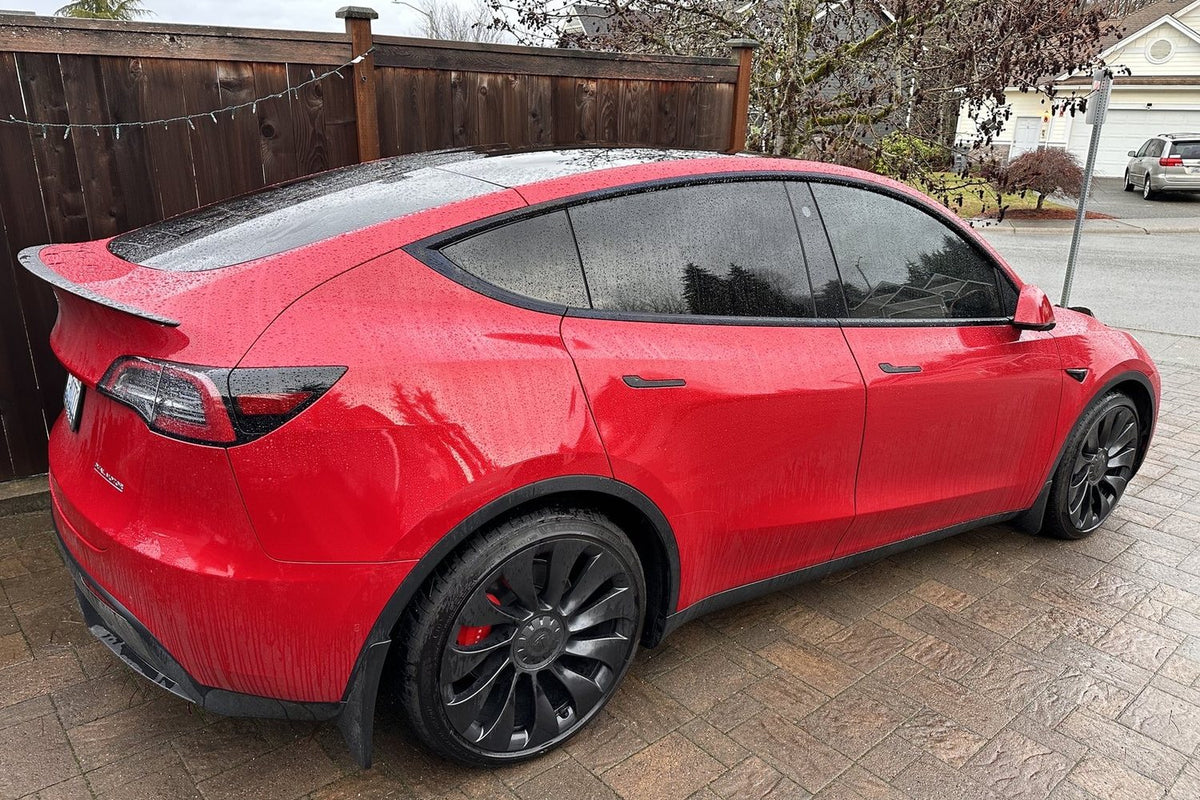 Red SUV with tinted side and rear windows